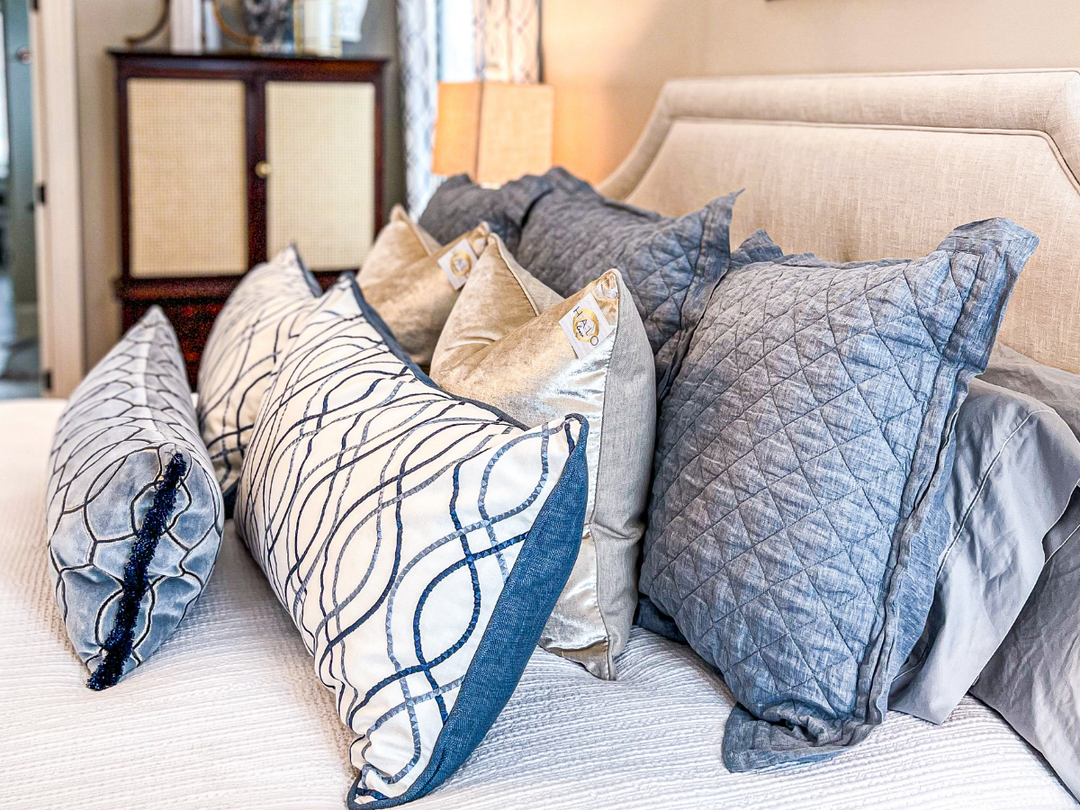 blue throw pillows on bed